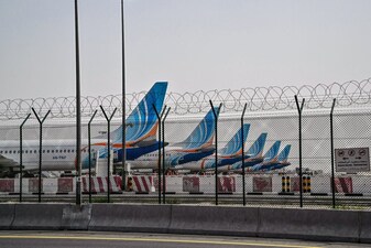 FlyDubai planes are parked on the tarmac at Dubai International Airport as Iran retaliates following the US and Israels assassination of its supreme leader, in Dubai on March 2, 2026. The United States hit hundreds of targets across Iran, and Israel expanded its bombing to Lebanon on March 2 as US President Donald Trump vowed to avenge the first US deaths in the war he launched to topple Tehran's ruling clerics. Iranian forces fired missiles and drones across the Middle East, killing people in Israel and the United Arab Emirates, in retaliation for the conflict that began Saturday with the death of Iran's supreme leader, Ayatollah Ali Khamenei. (Photo by Giuseppe CACACE / AFP)