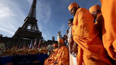 Bochasanwasi Akshar Purushottam Swaminarayan Sanstha (BAPS) Hindu monks take part in a religious ceremony in front of the Eiffel Tower before a ceremonial river parade on the river Seine in Paris on September 3, 2026. (Photo: Kenzo Tribouillard/AFP)