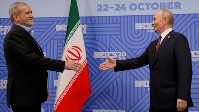 Russian President Vladimir Putin shakes hands with Iranian President Masoud Pezeshkian during a meeting on the sidelines of the Brics summit in Kazan, Russia, on October 23, 2024. Reuters File