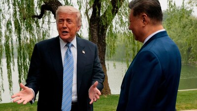 President Donald Trump, left, speaks as he is greeted by Chinese President Xi Jinping at Zhongnanhai Garden in Beijing, China, May 15, 2026.  File- AP