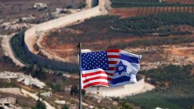 A mixed flag of the US and Israel flies in the northern Israeli Kibbutz of Misgav Am, in the Upper Galilee, near the Lebanese border on September 20, 2026.- AFP- File