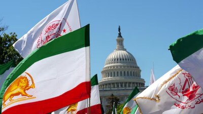 Flags are held by Iranian Americans and supporters of the National Council of Resistance of Iran during a march near the U.S. Capitol in Washington, D.C., U.S., May 16, 2026. REUTERS