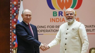 Russia's President Vladimir Putin (L) shakes hands with India’s Prime Minister Narendra Modi (R) during their meeting on the sidelines of the BRICS summit in New Delhi on September 11, 2026.- AFP