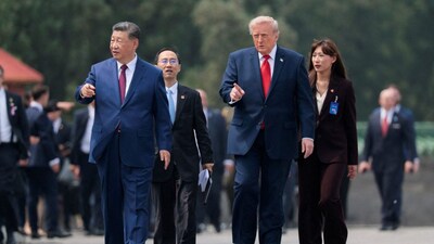 US President Donald Trump and Chinese President Xi Jinping walk together as they tour the Temple of Heaven in Beijing, China, May 14, 2026. File Image/Reuters