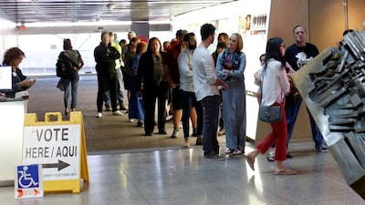 Voters wait to cast their midterm elections ballots at Burton Barr Library, a polling station in Phoenix, Arizona, US, November 6, 2018. File Image/Reuters
