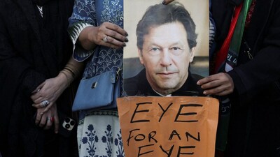 Supporters of jailed former Prime Minister Imran Khan's Pakistan Tehreek-e-Insaf (PTI) party carry a poster of him during a protest over concerns about their leader's health in Karachi, Pakistan, February 13, 2026. File image/Reuters