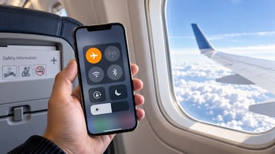 Aviation experts explain why passengers are asked to switch on airplane mode during flights and whether mobile phones can really affect aircraft safety systems. Photo: AI-generated