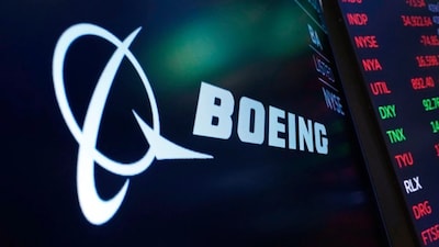 The logo for Boeing appears on a screen above a trading post on the floor of the New York Stock Exchange, July 13, 2021. AP