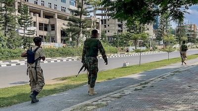 Members of the Tigray People's Liberation Front (TPLF) walk along a main road in Mekelle, as tensions intensify in northern Ethiopia after Tigrayan rebels seized control of airports in the region. AFP