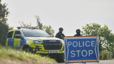 Police guard a road leading to RAF Fairford, in Fairford, England. AP File