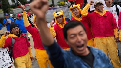 People wearing Winnie the Pooh costumes protest against Chinese President Xi Jinping as he meets U.S. President Donald Trump at the White House in Washington, DC. Reuters