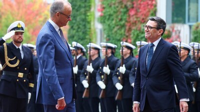 German Chancellor Friedrich Merz welcomes British Prime Minister Andy Burnham with military honours at the Chancellery in Berlin, Germany, on Thursday. Reuters