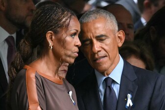 (L/R) Former First Lady Michelle Obama and former US President Barack Obama attend the 25th anniversary commemoration of the September 11, 2001 attacks at the National September 11 Memorial in New York on September 11, 2026. (Photo by ANGELA WEISS / AFP)