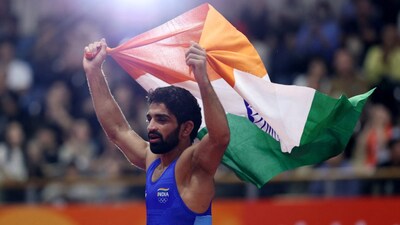 Aman Sehrawat produced a masterclass in the men's 57kg freestyle final, defeating North Korea's world champion Chong Song Han 11-7 to secure his maiden Asian Games gold medal. Image: Reuters