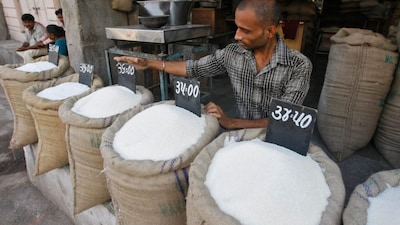 A vendor arranges a price tag over a sack filled with sugar at a wholesale vegetable market in the western Indian city of Ahmedabad, India, September 11, 2013. File image/Reuters