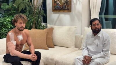 Actor Tiger Shroff sitting with Maharashtra Deputy CM Eknath Shinde after escaping an alleged assassination attempt. Image credit: @ANI/X