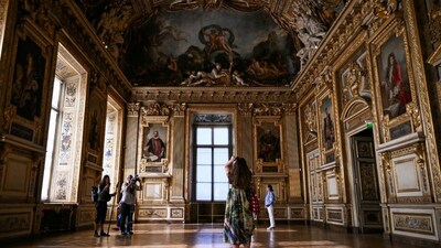 Visitors inside the Musée du Louvre in Paris. It's been a year since thieves decamped with precious jewels from inside the museum. AFP