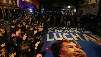Protesters gather outside the building where late Maricarmen Abascal, the 87-year-old woman whose eviction sparked nationwide housing protests, used to live, in Madrid, Spain, October 8, 2026. AP