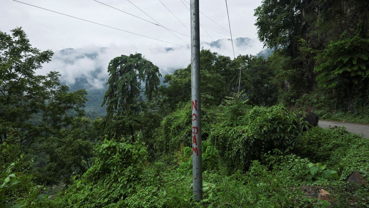 An electricity pole in Parong village displays a protest message against the proposed 11,500 MW Siang Upper Multipurpose Dam Project. Reuters