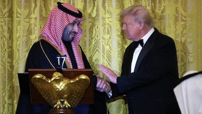 Saudi Crown Prince Mohammed bin Salman of Saudi Arabia and US President Donald Trump shake hands during a dinner in the East Room at the White House on November 18, 2025 in Washington, DC. (Photo: Win McNamee/Getty Images/AFP)