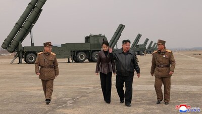 North Korean Supreme Leader Kim Jong Un, accompanied by his daughter Kim Ju Ae, oversees the test-launch of 600 mm-calibre multiple rocket launchers in North Korea on March 14, 2026 in this picture released by North Korea's official Korean Central News Agency. (Photo: KCNA via Reuters)