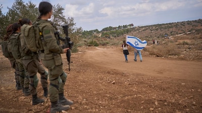Israeli soldiers are seen guarding the road between Ganim and Kadim as Israeli settlers celebrate the inauguration of a newly built illegal outpost in Kadim in the occupied West Bank on September 30, 2026. (Representational Photo, Credit: Ohad Zwigenberg/AP)