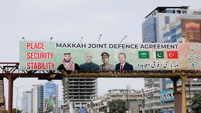 A hoarding displays portraits of Saudi Crown Prince Mohammed bin Salman, Pakistan's Prime Minister Shehbaz Sharif, Pakistan's Army chief Field Marshal Asim Munir, and Turkish President Recep Tayyip Erdogan after the signing of the Mecca Agreement in Karachi on August 9, 2026. (Photo: Akhtar Soomro/Reuters)
