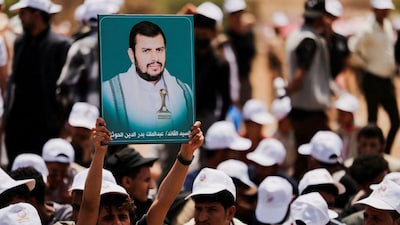 A student holds up a poster of Houthi leader Abdul-Malik al-Houthi during a parade at Sanaa University campus to show support for the Houthis amid an escalation with Saudi Arabia, in Sanaa, Yemen, July 22, 2026. File Image/Reuters