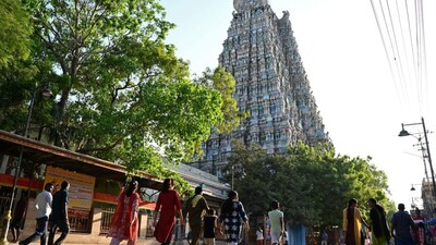 Hindu devotees walking outside the Meenakshi Amman temple in Madurai. File photo: AFP