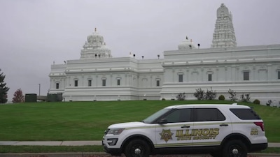 A security vehicle is parked outside of Sri Venkateswara Swami (Balaji) Temple in Aurora, Ill., on Thursday. Image- AP