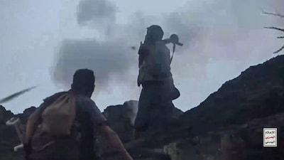 This screen grab taken from video footage released by Ansarullah Media Centre on October 7, 2026 shows a fighter affiliated with the Houthi authorities firing an RPG as they advance against Saudi-backed Yemeni government troops in Taiz Governorate, according to Houthi media.- Image- AFP