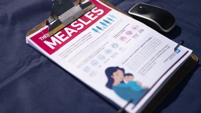 A fact sheet for measles sits on a table at a mobile clinic offering free vaccinations on February 6, 2026 in Spartanburg, South Carolina. (AFP)