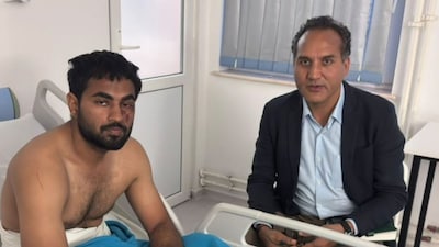 Indian officials meet three Indian nationals rescued after the MV Royad Mammadov was attacked in the Black Sea. One of the sailors was injured and is receiving medical treatment in Romania. (ANI)