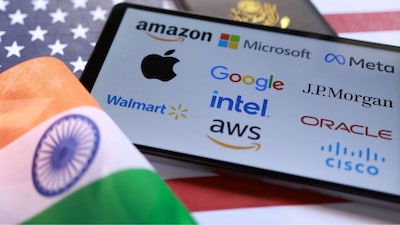 US and Indian flags, US H-1B Visa application form and displayed company logos are seen in this illustration taken September 26, 2025. File Image/Reuters