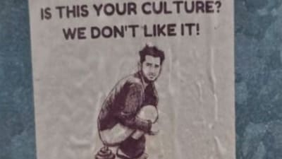 The racist sticker put up in Cessnock, Australia, depicts a man of Indian appearance defecating on a street, with the message “If this is your culture? We don’t like it” and a call for “Remigration now!” Image Courtesy: @TruthFairy131/X