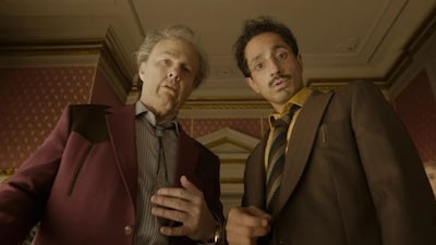 Tom Cruise and Riz Ahmed in a still from eco-satire 'Digger' breaking records of the wrong kind. Image Courtesy/Warner Bros