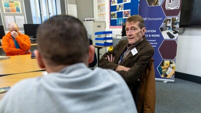 Author Lee Child at a prison literacy session at HMP Doncaster listening to an inmate’s feedback. Image Courtesy: Gary Calton/The Guardian