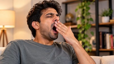 Why does yawning seem to spread from person to person? Experts say it is an automatic reaction involving brain networks tied to observation, imitation and social awareness. Photo: AI-generated