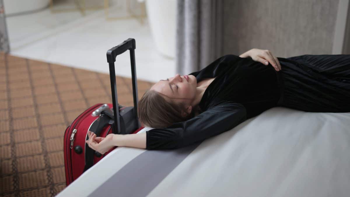 Why do we feel tired after travelling even when we have been sitting?