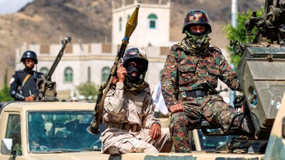 Houthi soldiers ride on military vehicles. Despite having spent billions on weaponry, Saudi Arabia is unable to fend off the attacks by the Yemeni rebels. File image/AFP