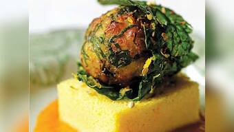 Spinach dumplings with tomato fenugreek sauce