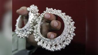 Silver prices plunge nearly 20%, but recover mildly