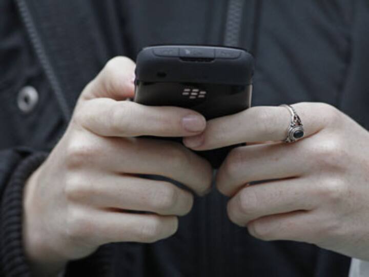 Text more, WHO sees cancer threat from cellphone use