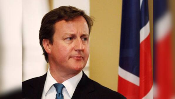 British PM fights back in hacking scandal