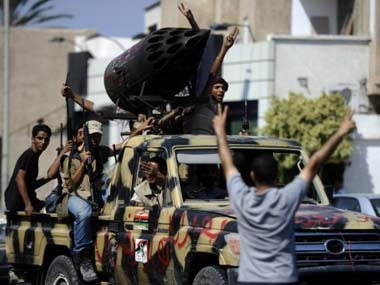 Rebels take Gaddafi's compound, son says dictator is in Libya Rebels take Gaddafi's compound, son says dictator is in Libya
