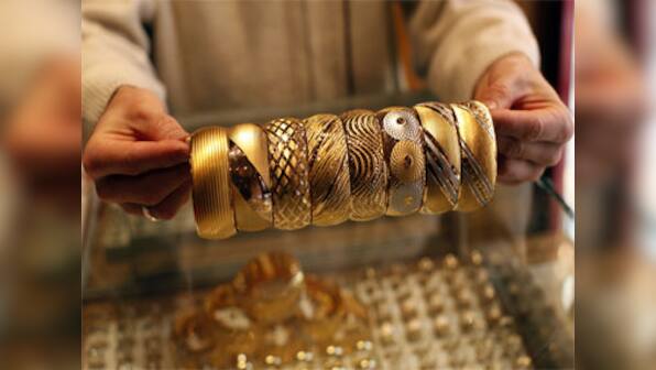 Gold down at Rs 28,340 on weak global cues