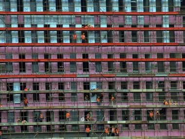 Labourers work at the construction site of a commercial estate in Chennai