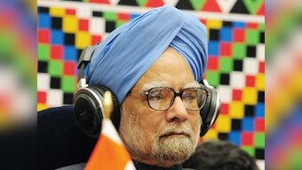 Journalists get a piece of cake from birthday boy Manmohan