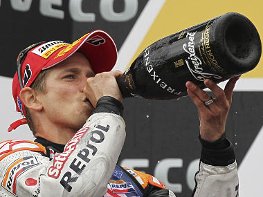 MotoGP: Stoner seals title after Lorenzo hurt MotoGP: Stoner seals title after Lorenzo hurt