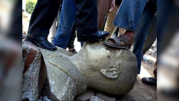 Saddam's bronze buttock up for auction in Britain